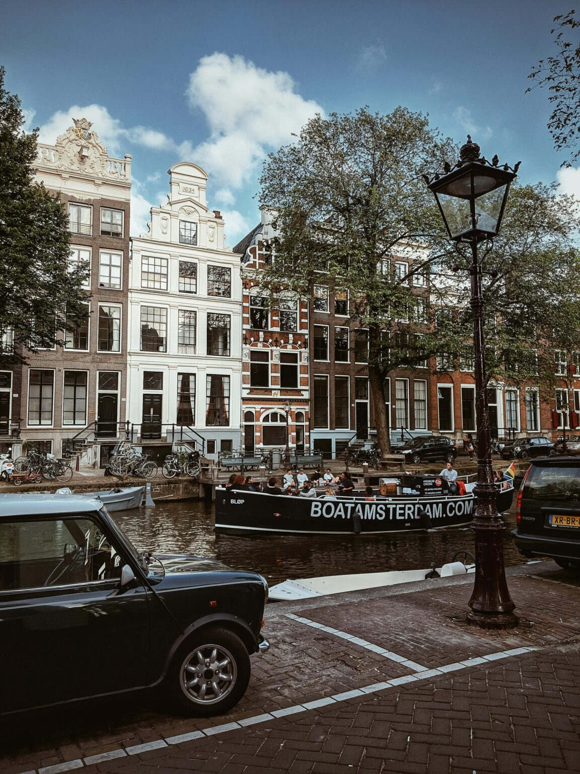 Explore the iconic canals and historic buildings of Amsterdam, showcasing classic Dutch architecture.